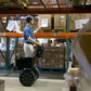 Segway  PT-SE i2 Self-Balancing Personal Transporter lifestyle image where you can see the model being used in a warehouse facility