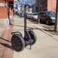 Segway  PT-SE i2 Self-Balancing Personal Transporter lifestyle photo on the pavement